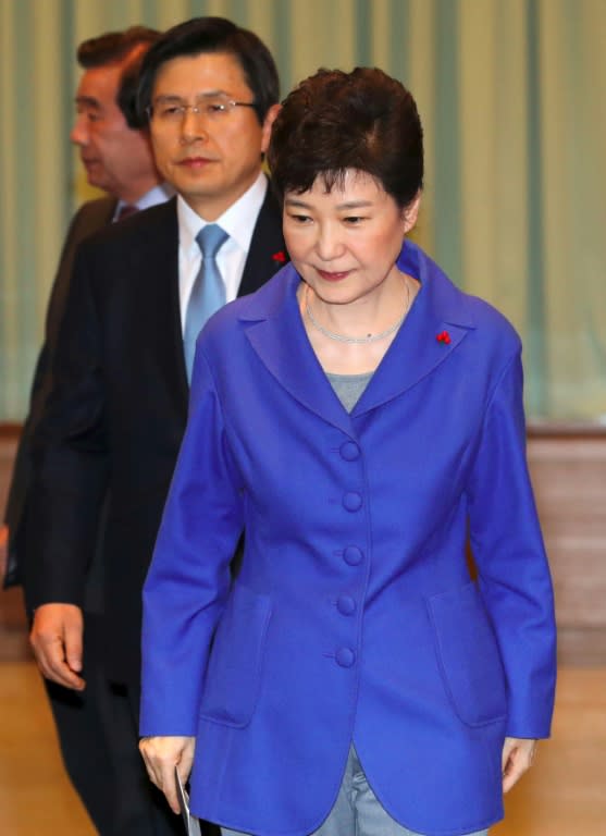 South Korean Prime Minister Hwang Kyo-Ahn (L) takes over as acting-president from President Park Geun-Hye