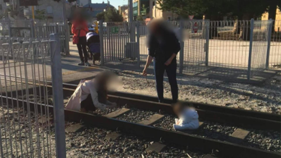 A woman was seen taking a photo of a baby on train tracks in Fremantle, Western Australia. Source: Twitter/The Bell Tower Times