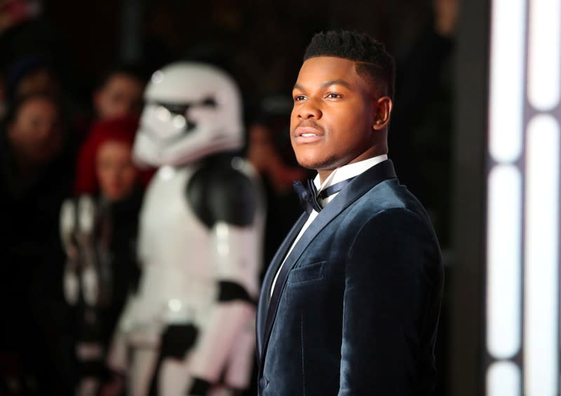 FILE PHOTO: Actor John Boyega poses for photographers as he arrives for the European Premiere of 'Star Wars: The Last Jedi', at the Royal Albert Hall in central London