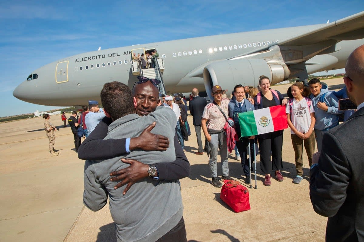 Passengers disembark in Madrid after fleeing Sudan on a Spanish Air Force aircraft (AP)