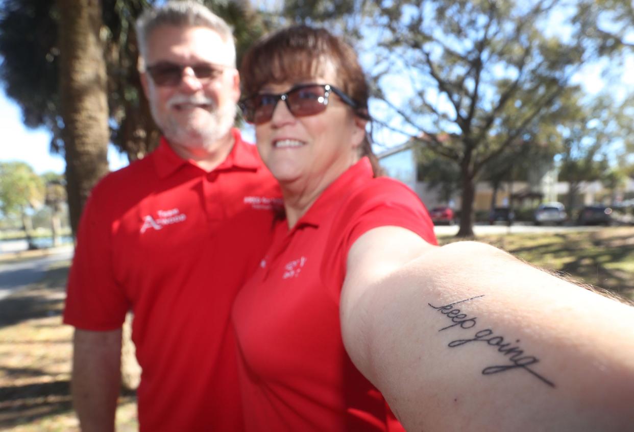 Kat Atwood shows the tattoo she got after being dignosed last year with autoimmune encephalitis, which caused seizures, memory loss and breathing difficulties. She was photographed with husband Ken, who has helped her "keep going," even after the illness forced her to resign just months after being elected to the Port Orange City Council.