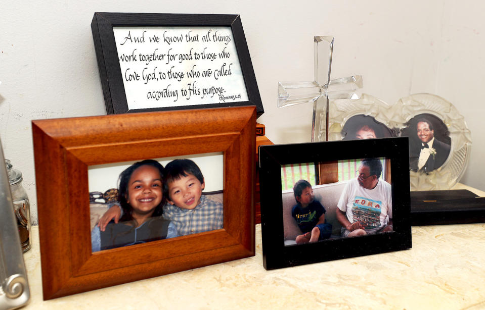 Image: Framed childhood photos of Christian Hall and family. (Fred Adams for Spotlight PA and NBC News)