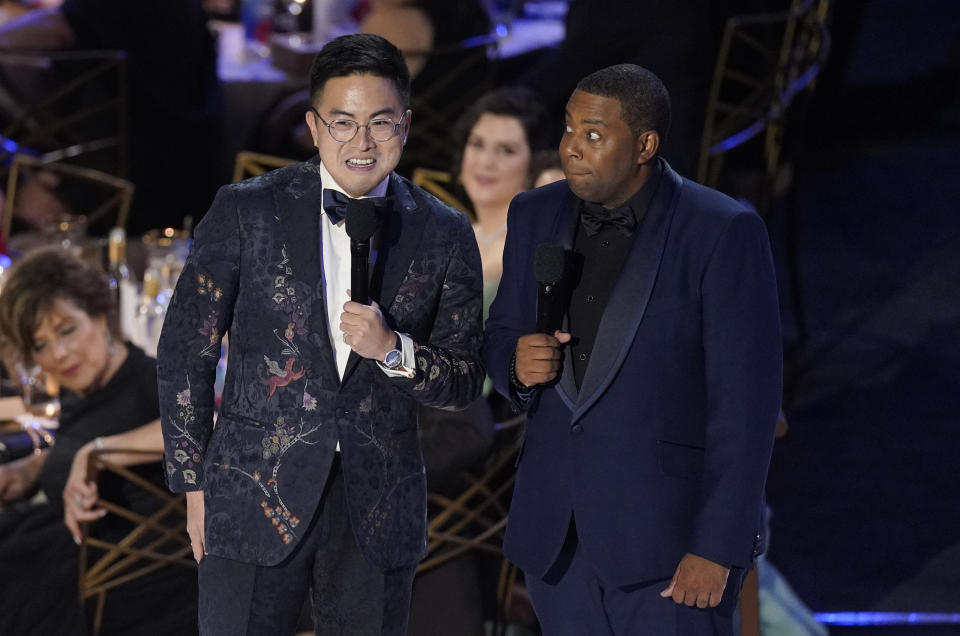 Bowen Yang, left, and host Kenan Thompson speak at the 74th Primetime Emmy Awards on Monday, Sept. 12, 2022, at the Microsoft Theater in Los Angeles. (AP Photo/Mark Terrill)