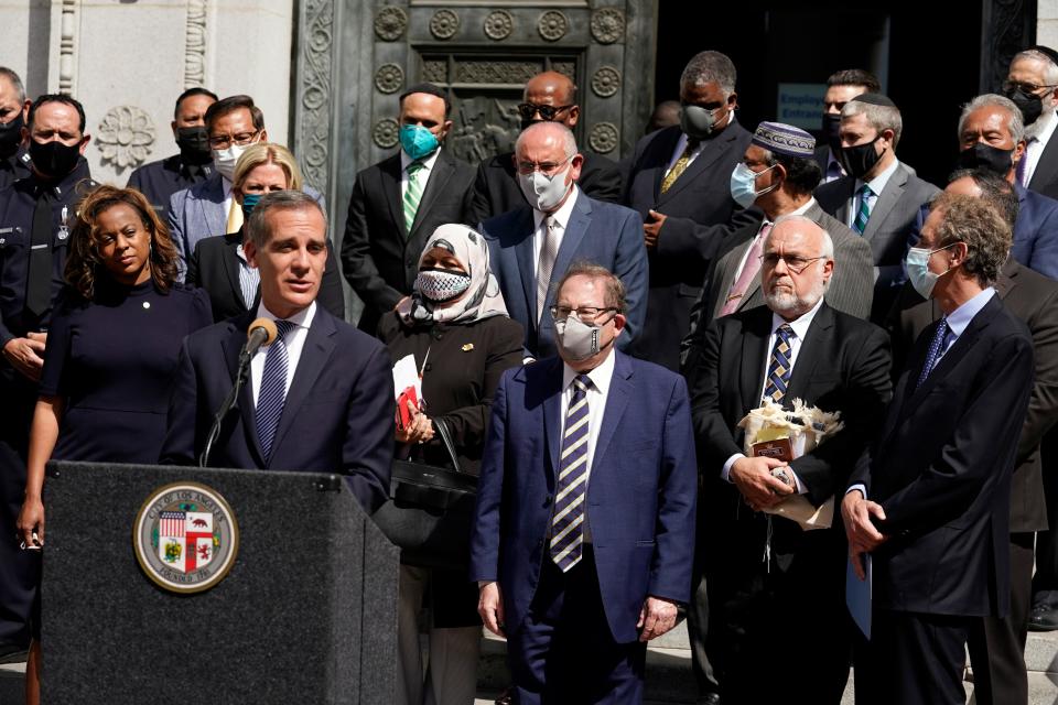 Los Angeles Mayor Eric Garcetti is pictured speaking in front of civic and faith leaders outside City Hall in Los Angeles. Faith and community leaders in Los Angeles called for peace, tolerance and unity in the wake of violence in the city that is being investigated as potential hate crimes