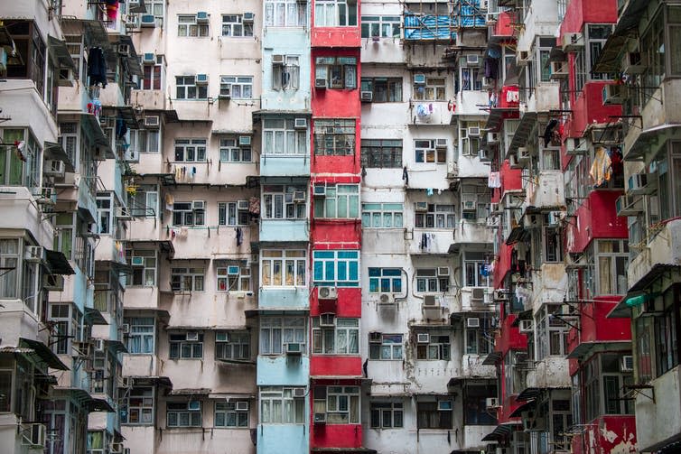 <span class="caption">Fewer people would not necessarily mean a smaller technosphere.</span> <span class="attribution"><a class="link " href="https://www.shutterstock.com/image-photo/background-hong-kong-residential-flat-building-701831104?src=1Dfl8njZJaVCuLVvkHkS8Q-1-46" rel="nofollow noopener" target="_blank" data-ylk="slk:Gunnerchu/Shutterstock.com;elm:context_link;itc:0;sec:content-canvas">Gunnerchu/Shutterstock.com</a></span>