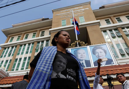 A supporter of Cambodia's late anti-government figure and the head of a grassroots advocacy group, "Khmer for Khmer" Kem Ley stands outside the court building in Phnom Penh, Cambodia March 23, 2017. REUTERS/Samrang Pring