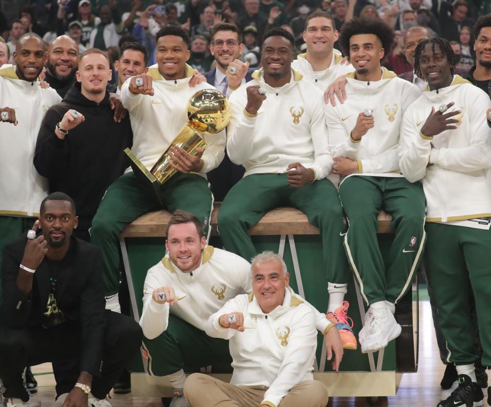 Milwaukee Bucks players, personnel, and owners show off their championship rings during a ring ceremony before the season opener against the Brooklyn Nets on Oct. 19 at Fiserv Forum.