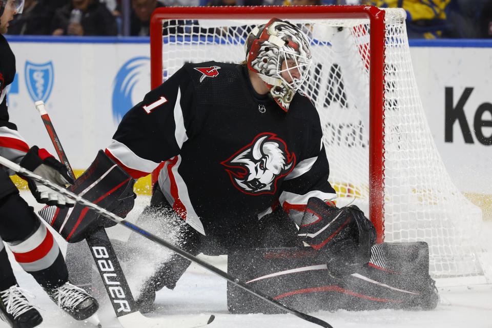 Buffalo Sabres goaltender Ukko-Pekka Luukkonen (1) makes a pad save during the second period of the team's NHL hockey game against the Detroit Red Wings, Thursday, Dec. 29, 2022, in Buffalo, N.Y. (AP Photo/Jeffrey T. Barnes)