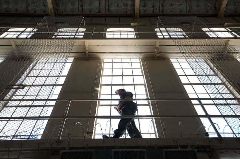 A prison guard carries his weapon while he walks along a catwalk inside East Block at San Quentin State Prison on Tuesday, Dec. 29, 2015, in San Quentin, California. TNS/ABACA/The Sacramento Bee/dpa