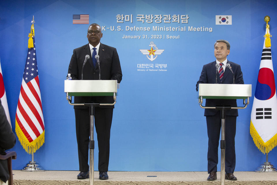 U.S. Secretary of Defense Lloyd Austin, left, speaks with South Korean Defense Minister Lee Jong-sup during a joint press conference after their meeting at the Defense Ministry in Seoul, South Korea, Tuesday, Jan. 31, 2023. (Jeon Heon-kyun/Pool Photo via AP)