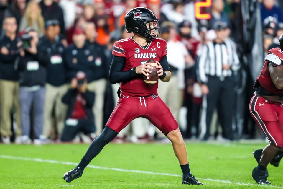 Nov 25, 2023; Columbia, South Carolina, USA; South Carolina Gamecocks quarterback Spencer Rattler (7) drops back to pass against the Clemson Tigers in the first quarter at Williams-Brice Stadium. Mandatory Credit: Jeff Blake-USA TODAY Sports