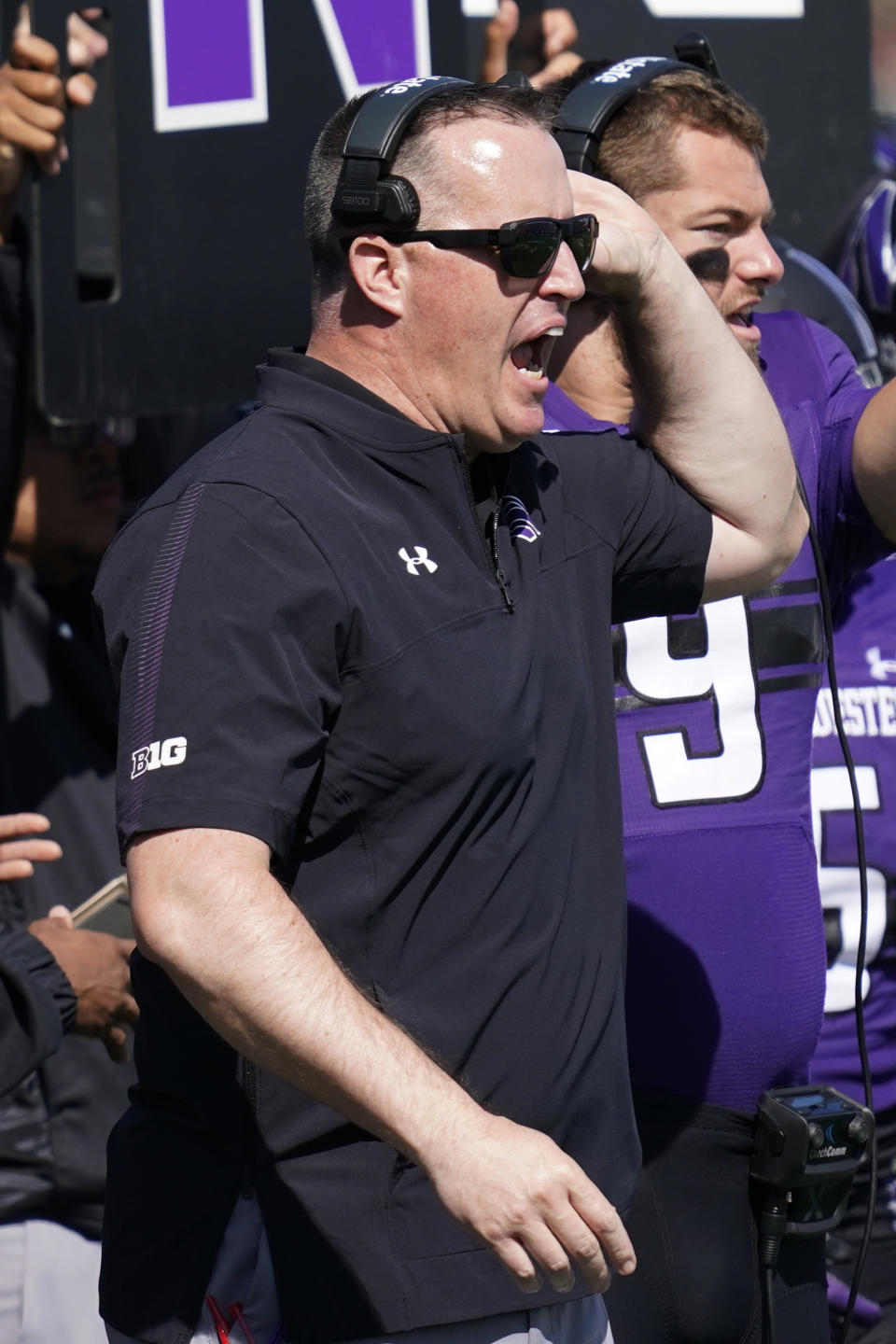 Northwestern head coach Pat Fitzgerald shouts out to his team during the first half of an NCAA college football game against Ohio in Evanston, Ill., Saturday, Sept. 25, 2021. (AP Photo/Nam Y. Huh)