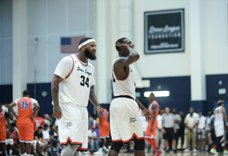 Teammates Jayceon “The Game” Taylor and Franklin Session celebrate during a game. (Photo courtesy of Aaron Poole/Drew League)