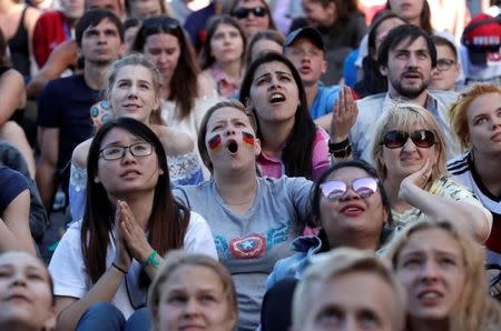 Soccer Football - World Cup - Group F - South Korea vs Germany- Saint Petersburg, Russia - June 27, 2018. Germany fan reacts as she watches the broadcast at Saint Petersburg Fan Fest. REUTERS/Henry Romero