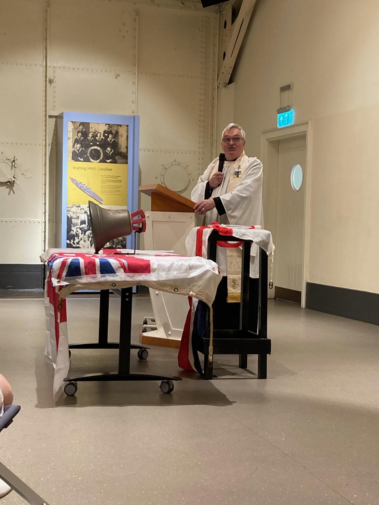 The Reverend Desmond Hanna carried out the triple christening on board HMS Caroline (Declan Roughan/PA)