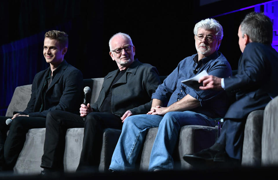 <p>Warwick Davis (Wicket from <em>Return of the Jedi</em>) emceed the panel that included (from left) Hayden Christensen, Ian McDiarmid, and George Lucas. (Photo: Gustavo Caballero/Getty Images) </p>