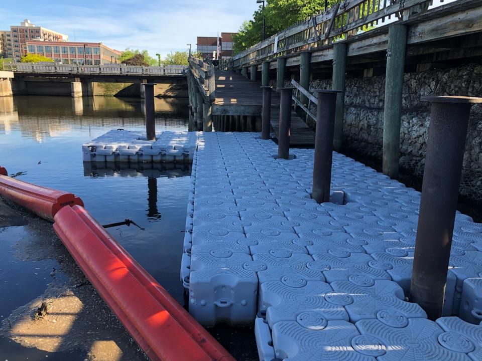 A temporary, plastic dock replaces the deteriorated wooden one at the start of South Bend's East Race Waterway for this summer.