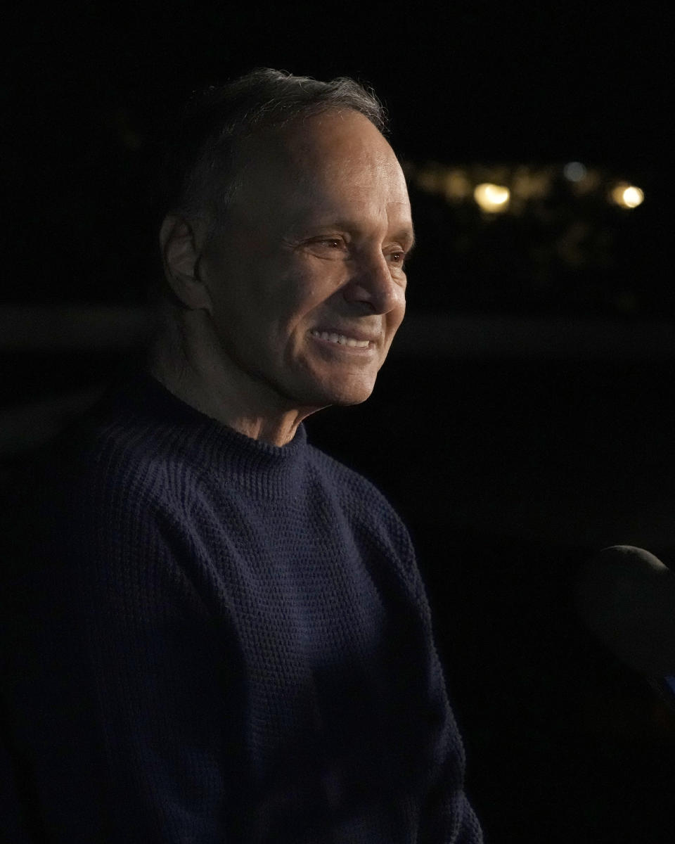 Uri Raanan smiles as he talks to reporters outside his Bannockburn, Ill., home, after his daughter Natalie and her mother Judith Raanan were released by Hamas, Friday, Oct. 20, 2023. (AP Photo/Charles Rex Arbogast)