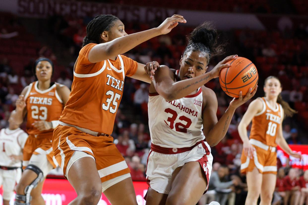 Oklahoma Sooners forward Sahara Williams (32) gathers the ball beside Texas Longhorns forward Madison Booker (35) during a women's college basketball game between the University of Oklahoma Sooners (OU) and the Texas Longhorns at Lloyd Noble Center in Norman, Okla., Wednesday, Feb. 28, 2024.