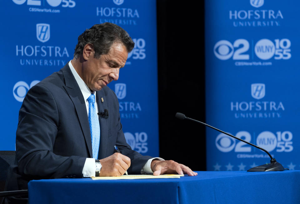 Gov. Andrew Cuomo takes notes during his debate with Democratic rival Cynthia Nixon at Hofstra University on Wednesday. (Photo: Pool via Getty Images)