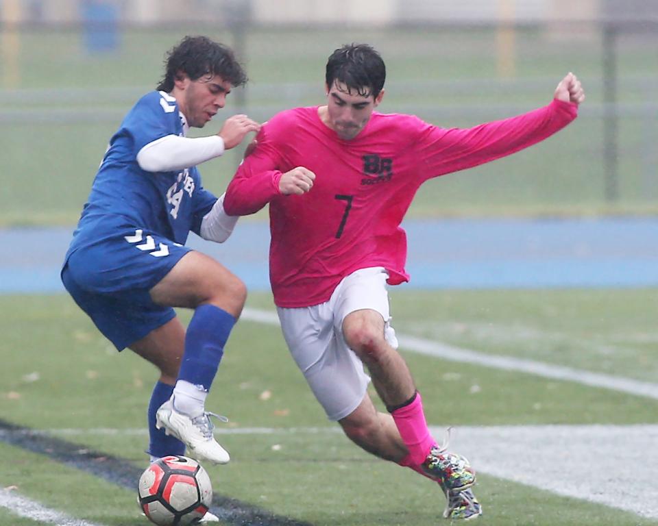 Bridgwater-Raynham's Austin Majer battles Braintree's Michael Rufo for the ball during second half action of their game against Braintree at Braintree High on Tuesday, Oct. 4, 2022. 