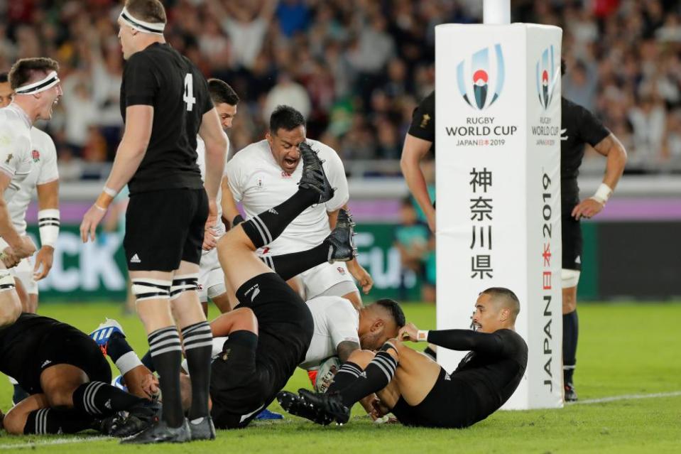 England players celebrate after Manu Tuilagi’s try.