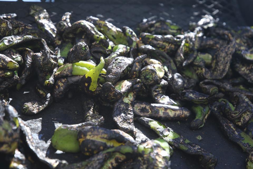 Joseph Quintero roasts Hatch green chiles, Aug. 9, 2023 at La Tienda in Carlsbad.