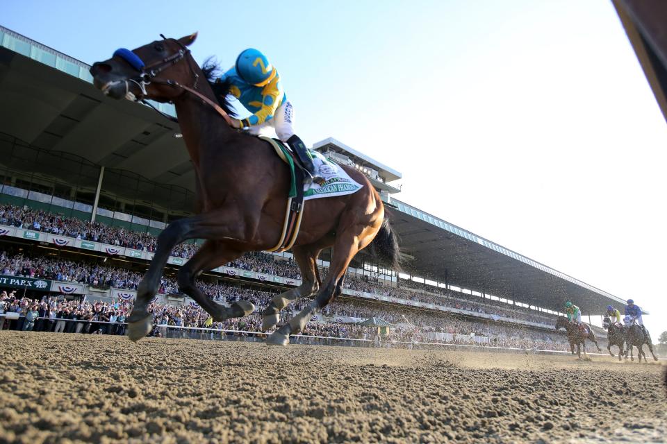 Jockey Victor Espinoza looks back at the competition as American Pharoah wins the Belmont Stakes and the first Triple Crown in 38 years on June 6, 2015.