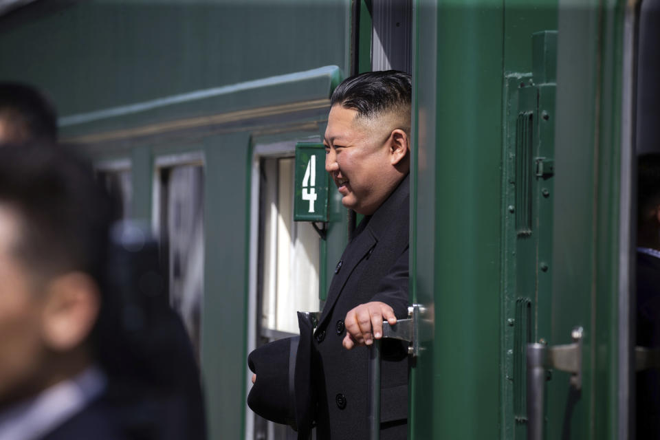 In this photo released by Press office of the administration of Primorsky Krai region, North Korean leader Kim Jong Un looks out from his train as he leaves Russia, at the main train station in Vladivostok, Russia, Friday, April 26, 2019. North Korean leader Kim Jong Un paid his respects at a ceremony honoring the war dead Friday before wrapping up a brief and generally successful visit to the Russian Far East for his first summit with President Vladimir Putin. (Alexander Safronov/Press Office of the Primorye Territory Administration via AP)