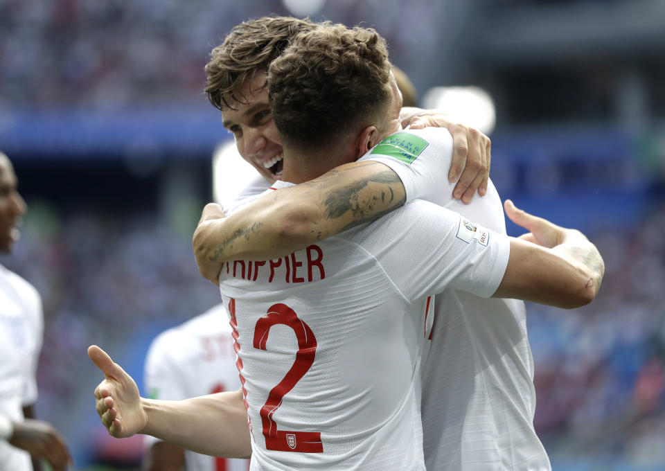 <p>England’s John Stones is congratulated by teammate Kieran Trippier after scoring his team’s first goal </p>