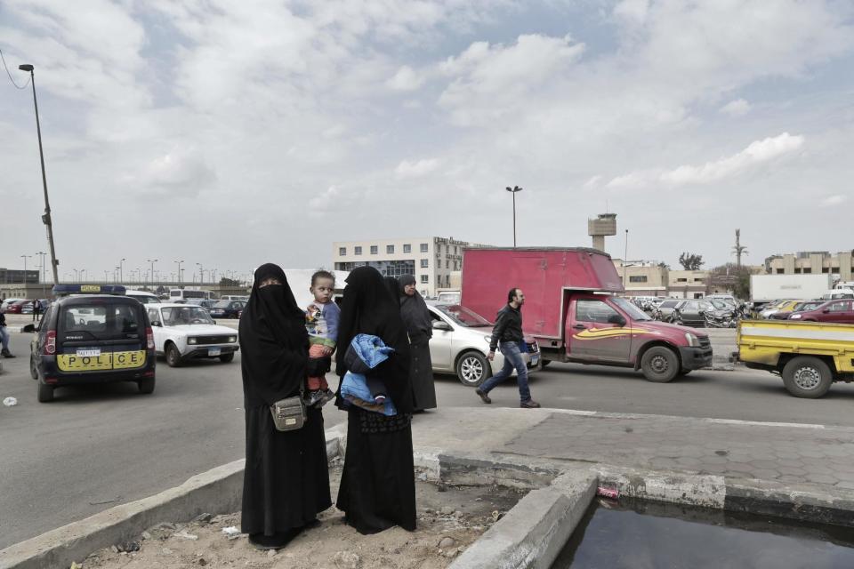 Asmaa, the daughter of Sheik Omar Abdel-Rahman, who was convicted of plotting terror attacks in New York City in the decade before 9/11, waits for the body's arrival at Cairo International Airport, in Egypt, Wednesday, Feb. 22, 2017. Abdel-Rahman, blind since infancy from diabetes, had diabetes and coronary artery disease, died Saturday at the Federal Correction Complex in Butner, North Carolina, said its acting executive assistant, Kenneth McKoy. The inmate spent seven years at the prison medical facility while serving a life sentence. (AP Photo/Nariman El-Mofty)