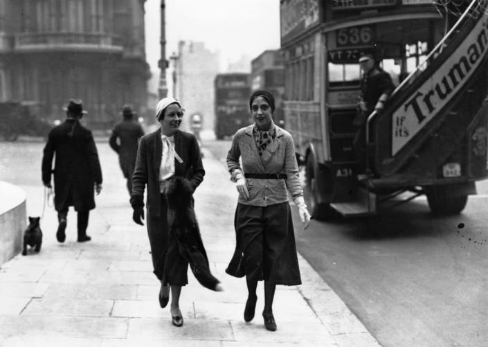 Schiaparelli (right) arrives in London 1935 wearing her latest fashion design, the trousered skirt or culottes (Getty)