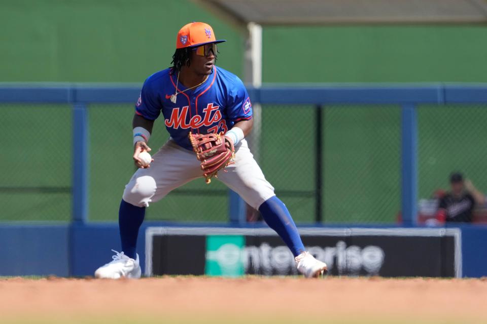 New York Mets second baseman Luisangel Acuna throws to first during the second inning of a spring training baseball game against the Washington Nationals Monday, Feb. 26, 2024, in West Palm Beach, Fla.