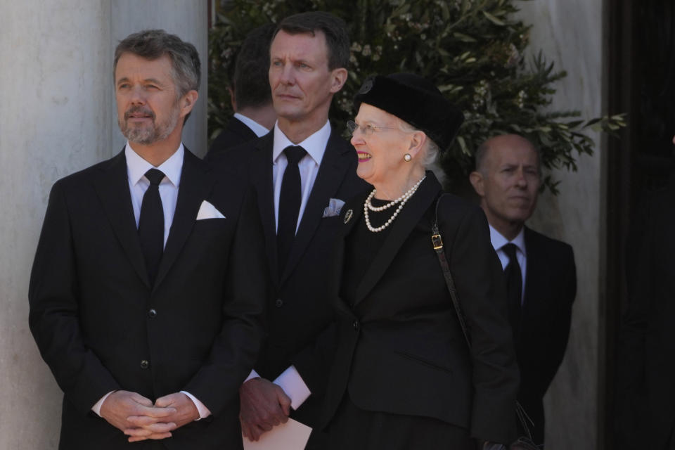 Denmark's Crown Prince Frederik, left, and Queen Margrethe II of Denmark stand outside of the Metropolitan Cathedral during the funeral of former king of Greece Constantine II in Athens, Monday, Jan. 16, 2023. Constantine died in a hospital late Tuesday at the age of 82 as Greece's monarchy was definitively abolished in a referendum in December 1974. (AP Photo/Petros Giannakouris)