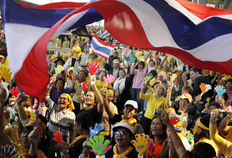 FILE - Anti-goverment protesters cheer as they hear the news that Prime Minister Somchai Wongsawat's ruling People's Power Party must disband at Suvarnabhumi Airport on Dec. 2, 2008 in Bangkok, Thailand. A court in Thailand on Wednesday, Jan.17, 2024, acquitted a group of protesters who had occupied Bangkok’s two airports in 2008 of charges of rebellion and terrorism related to the demonstration, which at the time disrupted travel in and out of the country for more than a week. (AP Photo/Ed Wray)