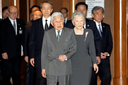 Japanese Emperor Akihito (L) and Empress Michiko (R) arrive for a meeting with family members of Japanese veterans living in Vietnam, at a hotel in Hanoi, Vietnam, March 2, 2017. REUTERS/Minh Hoang/Pool