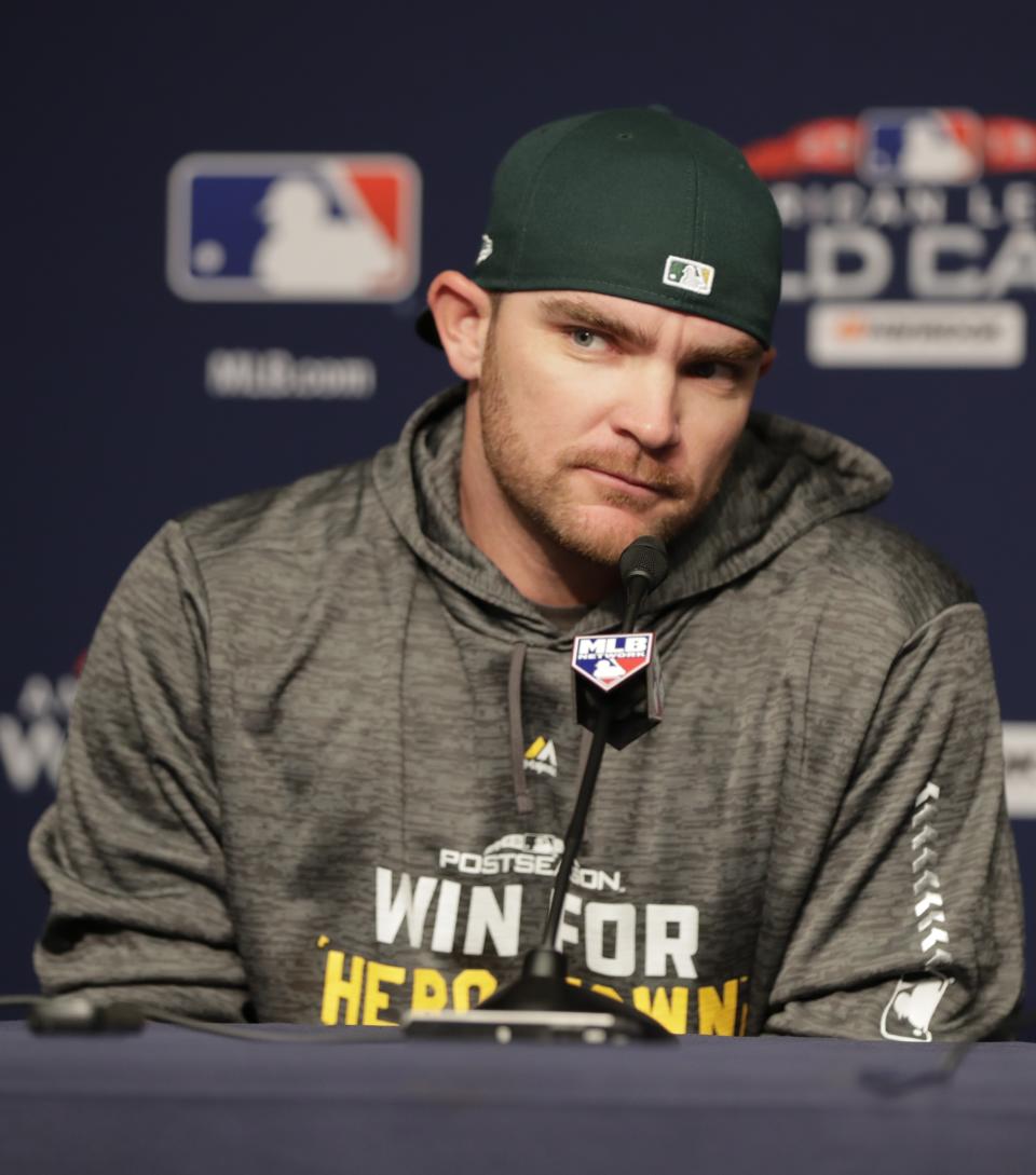 FILE - In this Oct. 2, 2018, file photo, Oakland Athletics relief pitcher Liam Hendriks, of Australia, speaks during a news conference before their upcoming American League wildcard baseball game against the New York Yankees, in New York. Manager Bob Melvin and the Oakland Athletics have put their faith in Hendriks to finish games as a reliable ninth-inning option night after night. Never one to stick with traditional methods and frustrated with himself last year in Triple-A, Hendriks searched for a way to transform his mental approach. This good-natured Aussie was in need of an attitude shift. And an energy healer named Rubi Rios sure provided a nice assist in his transformation process. (AP Photo/Frank Franklin II, File)