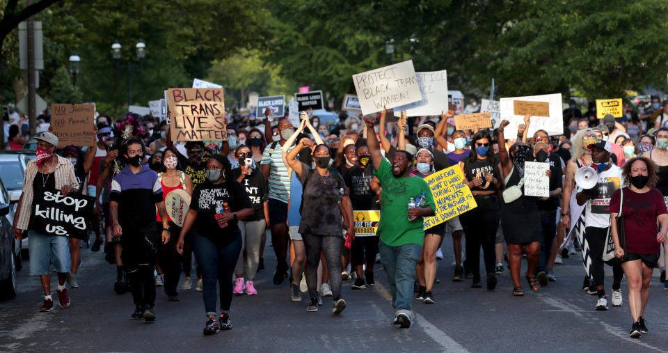 FILE - In this June 28, 2020, file photo, hundreds of protesters march down Waterman Boulevard headed to St. Louis Mayor Lyda Krewson's home in St. Louis. The protesters demanded Krewson's resignation after she read the names and addresses of several residents who supported defunding the police department during an online briefing. (Robert Cohen/St. Louis Post-Dispatch via AP, File)