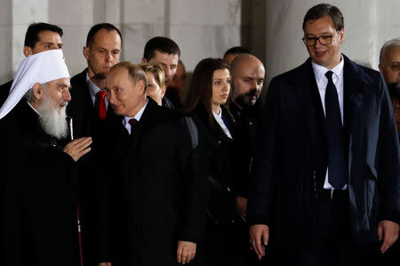 Serbian President Aleksandar Vucic, Russian President Vladimir Putin and Serbian Orthodox Church Patriarch Irinej leave the St Sava temple in Belgrade, Serbia, January 17, 2019. REUTERS/Kacper Pempel