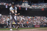 Pittsburgh Pirates' Henry Davis walks to the dugout after striking out during the fifth inning of a baseball game against the San Francisco Giants, Sunday, April 28, 2024, in San Francisco. (AP Photo/Godofredo A. Vásquez)