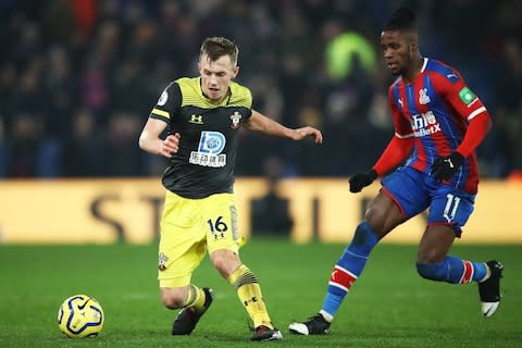 James Ward-Prowse of Southampton avoids a tackle from Wilfried Zaha of Crystal Palace during the Premier League match between Crystal Palace and Southampton FC at Selhurst Park - Credit: GETTY IMAGES