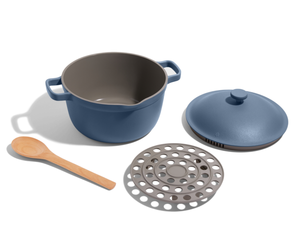 Blue Perfect Pot with steamer tray and wooden spoon.