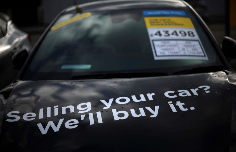 A used KIA EV6 electric car is seen for sale outside the showroom of a used car dealer in Manchester