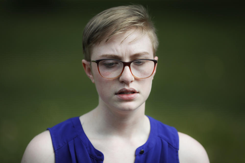 Adelia Johnson, who briefly dated Connor Betts, who fatally gunned down people on Sunday in Dayton, Ohio, speaks to members of the media in Belmont Park in Dayton on Tuesday, Aug. 6, 2019. (AP Photo/John Minchillo)