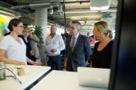 German Interior Minister Thomas de Maiziere talks to employees during a vistit at the Facebook office in Berlin, Germany August 29, 2016. REUTERS/Stefanie Loos