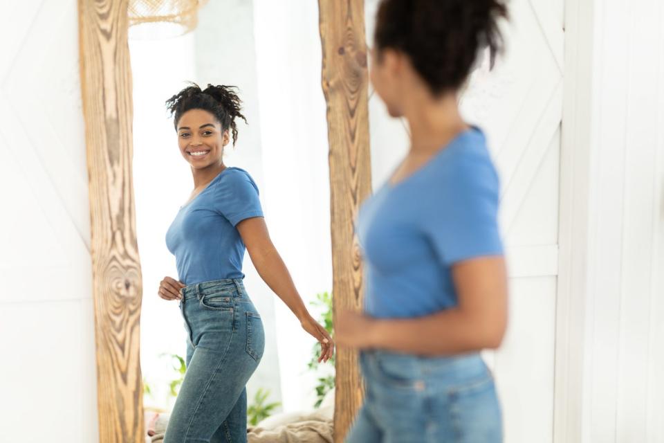 Woman smiling in mirror