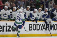 Vancouver Canucks center Pius Suter (24) celebrates his goal against the Nashville Predators with teammates during the third period in Game 6 of an NHL hockey Stanley Cup first-round playoff series Friday, May 3, 2024, in Nashville, Tenn. The Canucks won 1- 0. (AP Photo/George Walker IV)