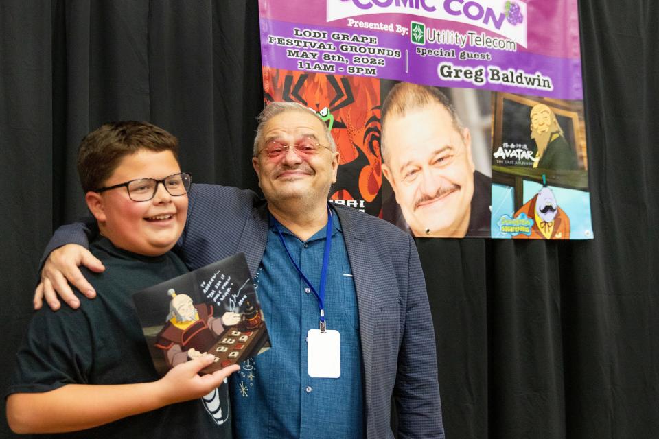 Andrew Hilbert, 10, is all smiles after meeting and getting is autograph from his favorite 'Avatar: the Last Airbender' voice actor, Greg Baldwin, at the Lodi Comic Con at Lodi Grape Festival on May 8th. Dianne Rose/For The Record