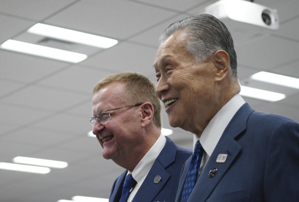 John Coates, left, chairman of the IOC Coordination Commission for the 2020 Tokyo Olympics and Paralympics and Tokyo Olympic organizing committee President Yoshiro Mori walk together away from the venue of the IOC and Tokyo 2020 joint press conference Wednesday, Sept. 12, 2018. (AP Photo/Eugene Hoshiko)