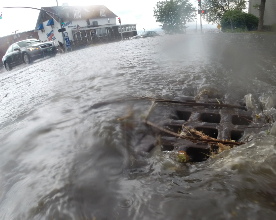 Rainwater floods into a storm drain at Battery and King streets in Burlington on Aug. 7, 2017. The city subsequently overhauled drain systems at the intersection, and water flows are less "flashy." Below-ground storage tanks in the area also slow rainfall's passage to the wastewater treatment plant.